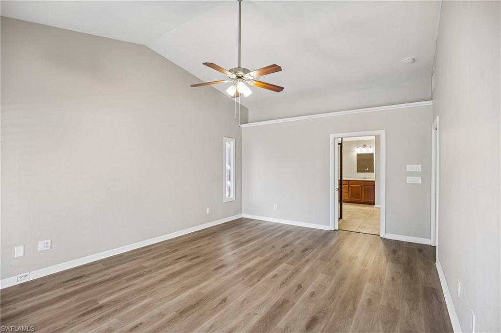 1937 Princess Court Naples, FL 34110 - Photo 22 of 42 wooden floor in an empty room