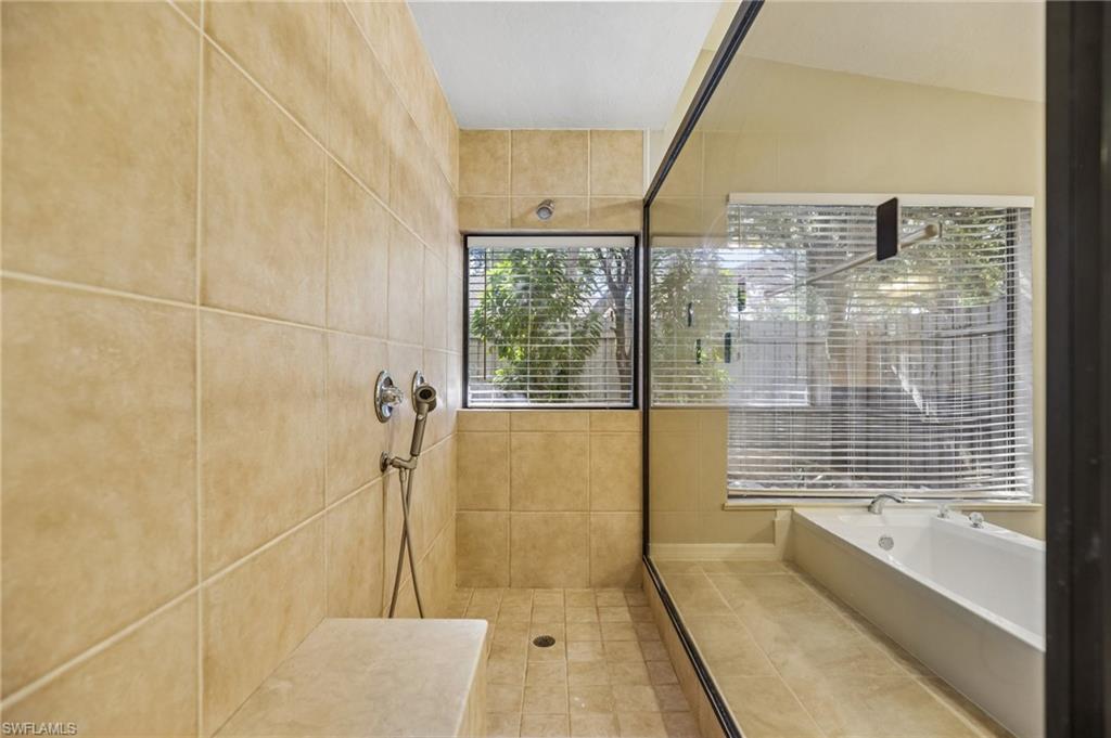 1937 Princess Court Naples, FL 34110 - Photo 23 of 42 a bathroom with a bathtub and shower