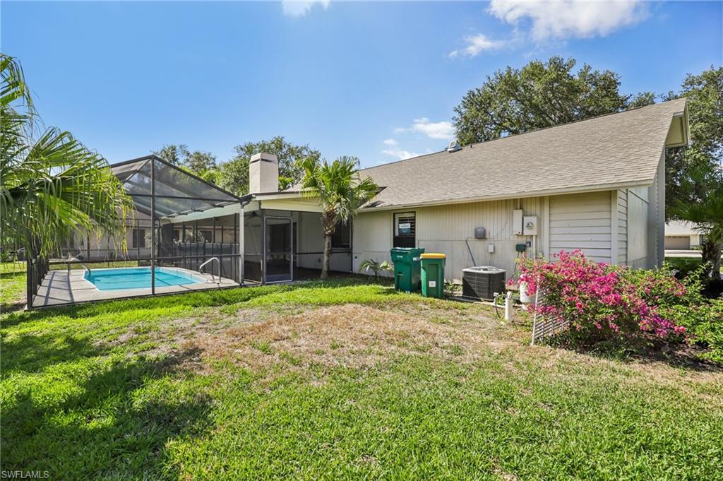 1937 Princess Court Naples, FL 34110 - Photo 39 of 42 a view of a house with backyard and sitting area