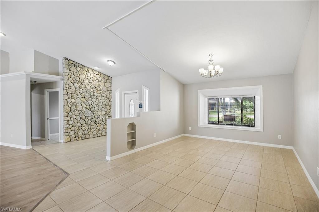 1937 Princess Court Naples, FL 34110 - Photo 10 of 42 a view of an empty room with a window