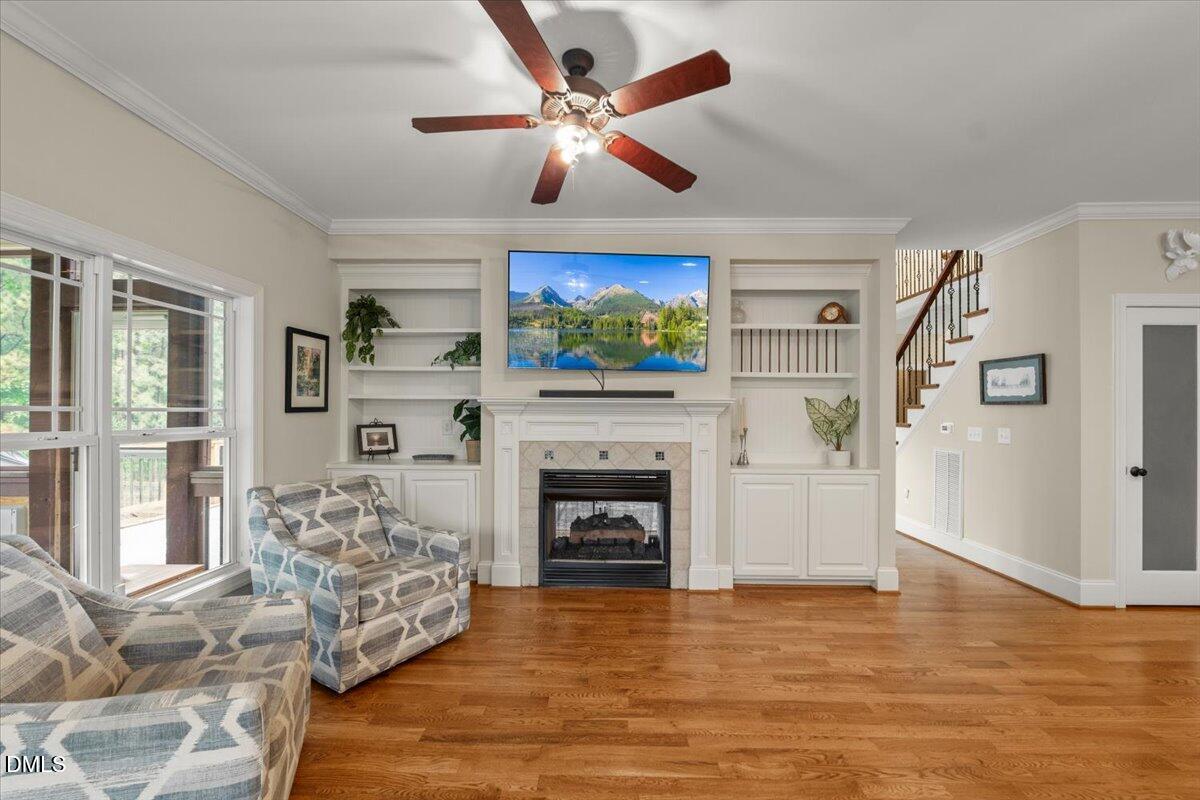 7400 Denlee Road Raleigh, NC 27603 - Photo 16 of 47 a living room with furniture fireplace and flat screen tv