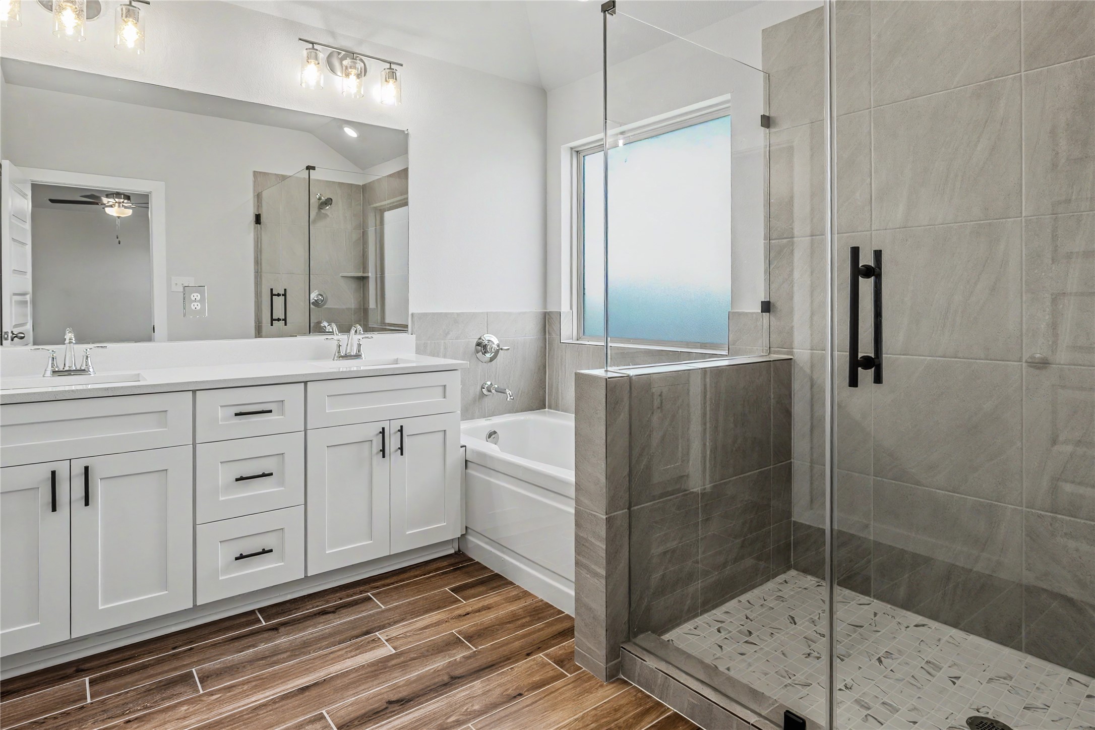 6427 Bolinas Court Rosharon, TX 77583 - Photo 23 of 49 a spacious bathroom with a shower a sink and mirror