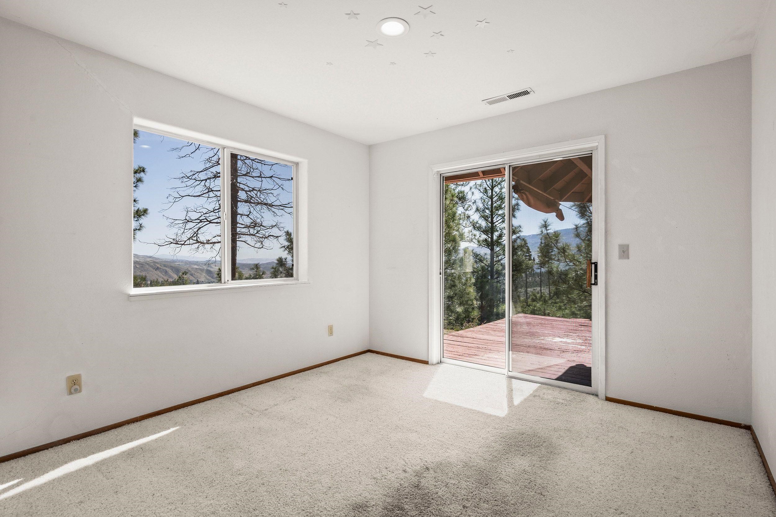 1020 Sunrise Creek Road Loyalton, CA 96118 - Photo 18 of 27 an empty room with windows