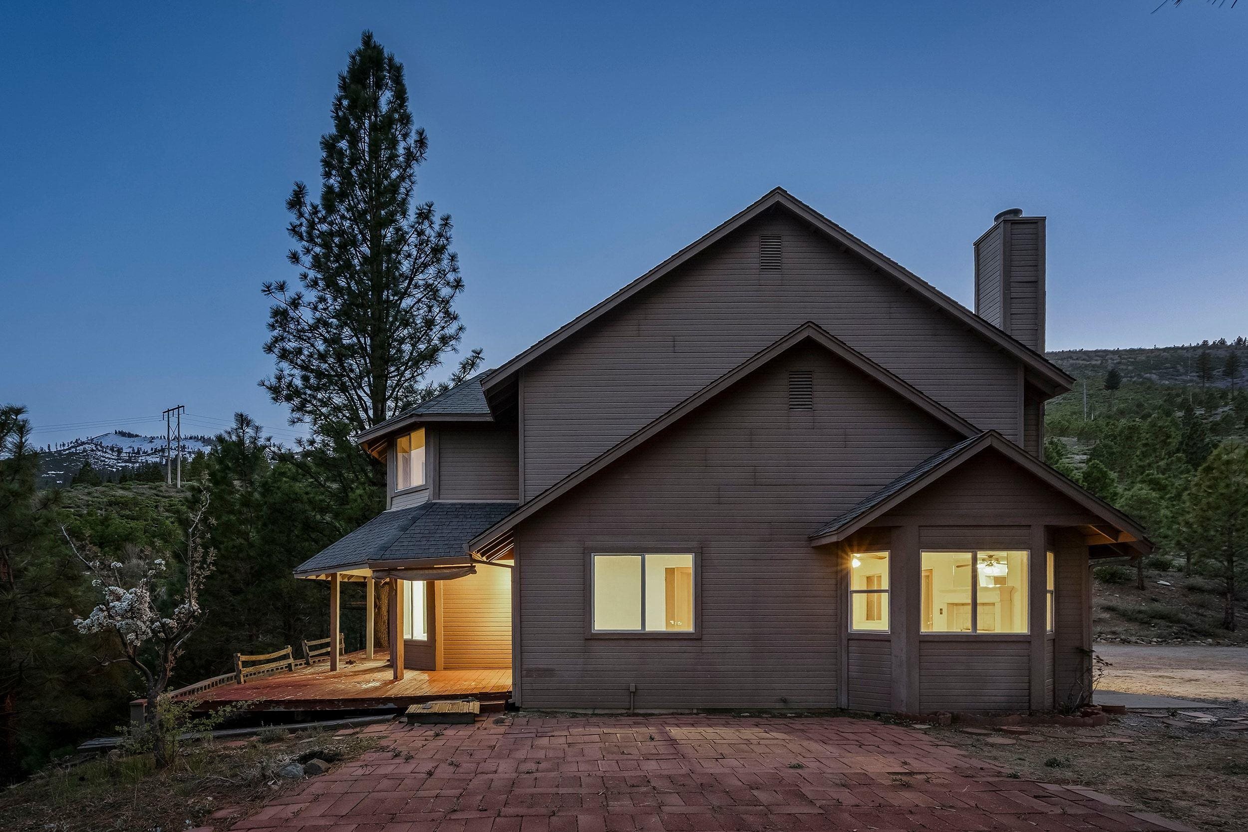 1020 Sunrise Creek Road Loyalton, CA 96118 - Photo 3 of 27 a front view of a house with a yard and garage