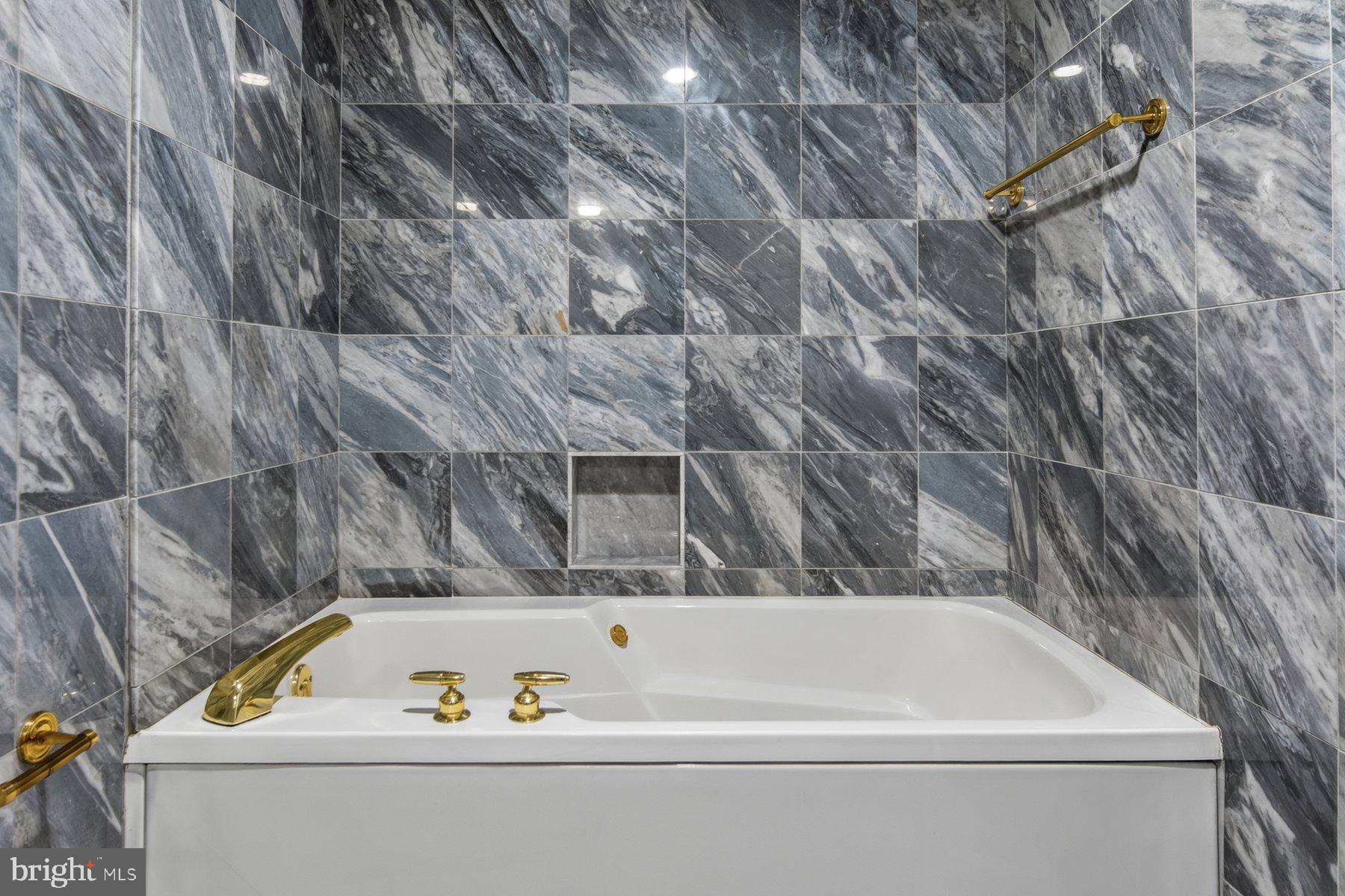 3801 Canterbury Road, Unit 403 Baltimore, MD 21218 - Photo 21 of 25 Luxurious marble-clad spa retreat.