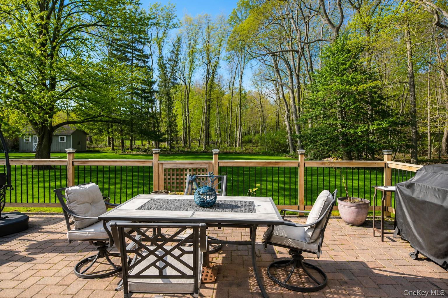 5 Stillwood Road Brookhaven, NY 11719 - Photo 6 of 22 Patio adjacent to fully fenced vegetable garden.