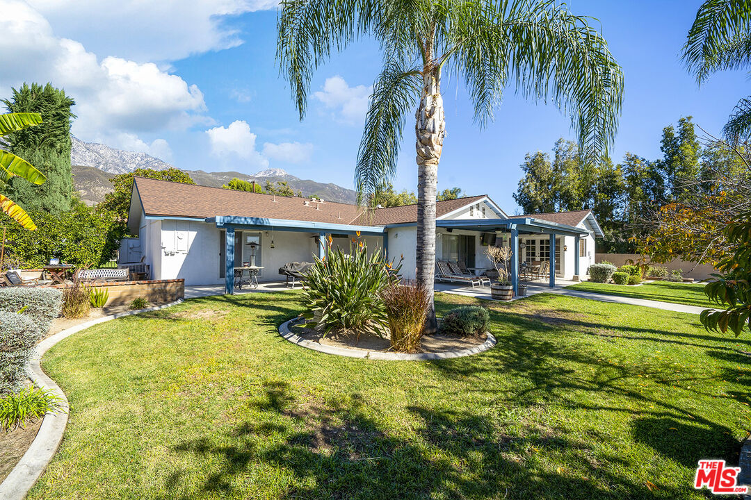 8391 Hillside Road Rancho Cucamonga, CA 91701 - Photo 16 of 51 a front view of a house with a yard