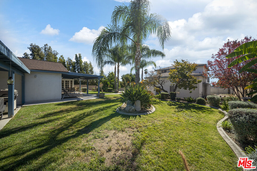 8391 Hillside Road Rancho Cucamonga, CA 91701 - Photo 17 of 51 a front view of house with yard and swimming pool