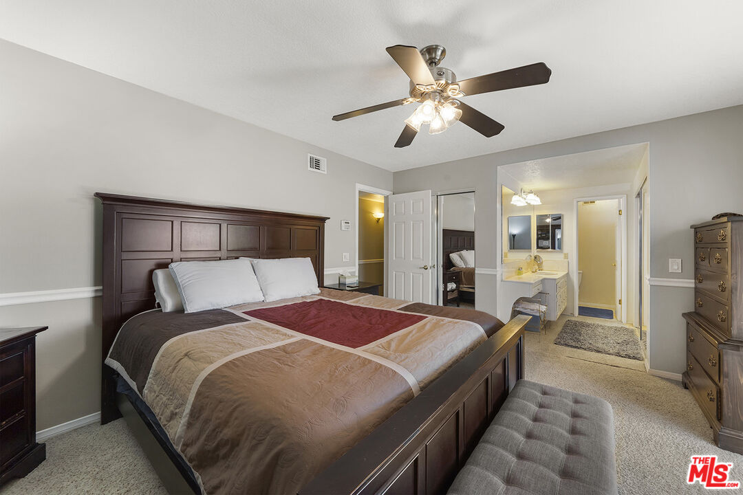 8391 Hillside Road Rancho Cucamonga, CA 91701 - Photo 33 of 51 a bedroom with a bed and wooden floor