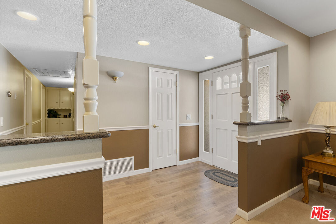 8391 Hillside Road Rancho Cucamonga, CA 91701 - Photo 38 of 51 a living room with furniture kitchen view and a chandelier