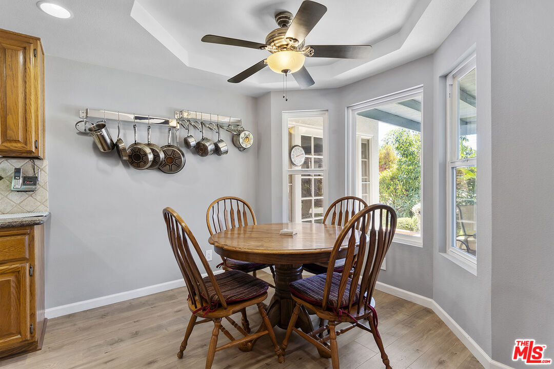 8391 Hillside Road Rancho Cucamonga, CA 91701 - Photo 40 of 51 a view of a dining room with furniture and a chandelier