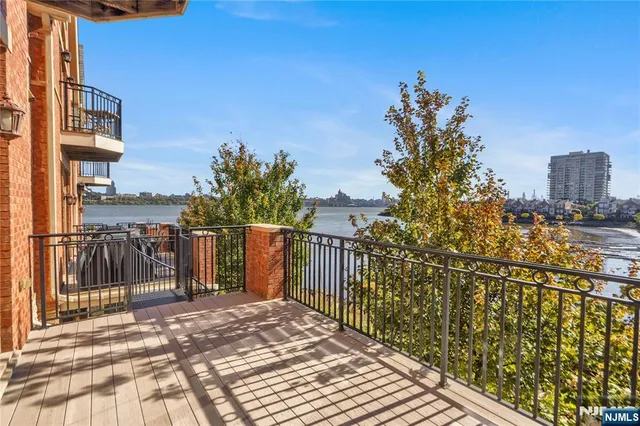 a view of buildings from the balcony