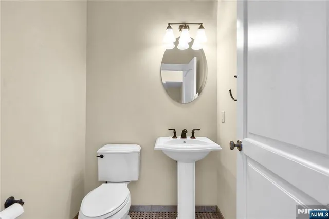 a spacious bedroom with a bed and a chair