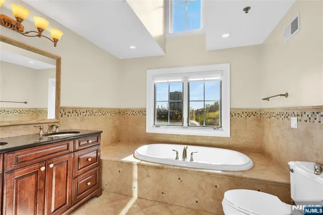 a view of room with wooden floor and a window