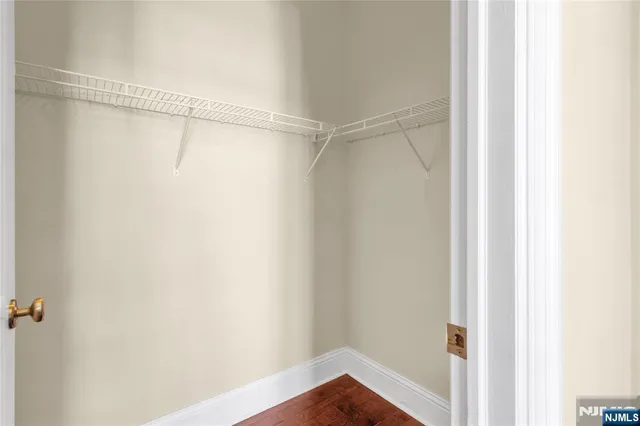 a bathroom with a white bath tub and a shower