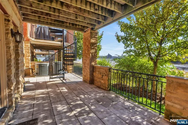 a bedroom with bed and a large window