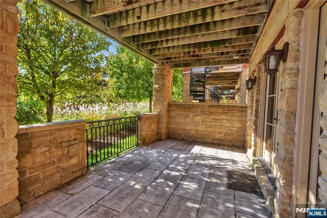 a bathroom with a granite countertop sink toilet a mirror and shower
