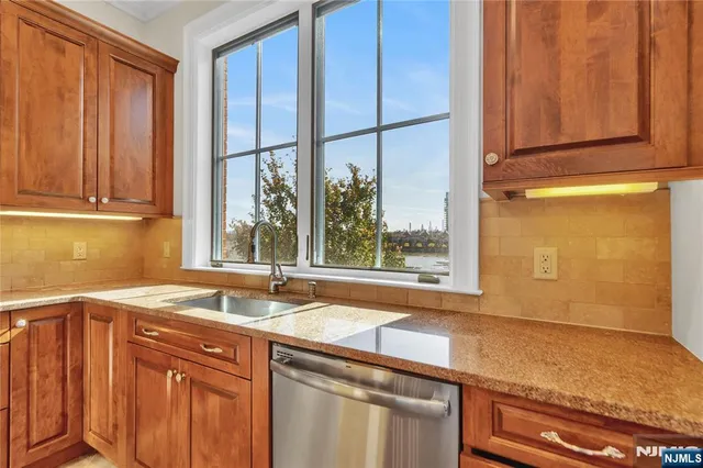 a kitchen with a sink and a window