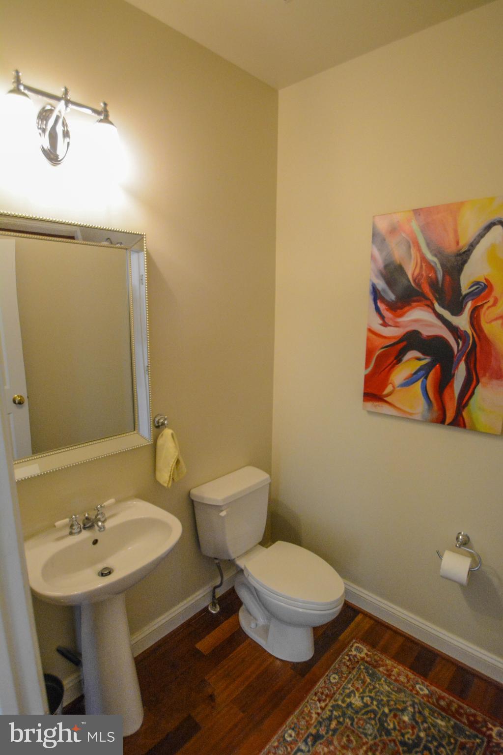 104 Camp David Road Wilmington, DE 19810 - Photo 16 of 32 a bathroom with a toilet a sink and mirror