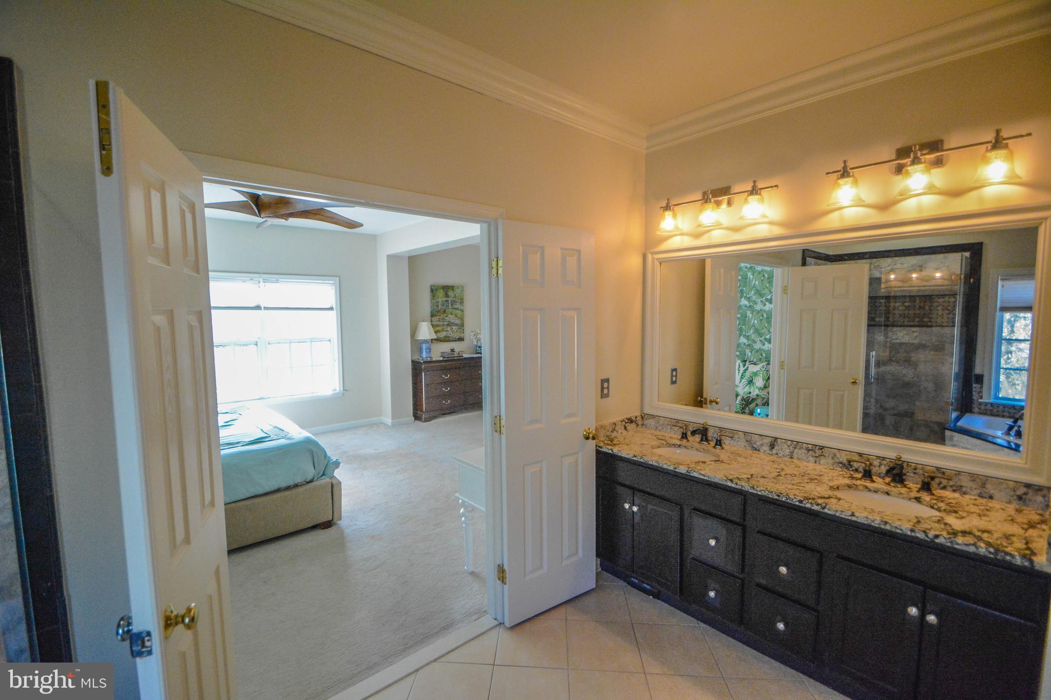 104 Camp David Road Wilmington, DE 19810 - Photo 19 of 32 a en suite bathroom with a double vanity sink and a mirror