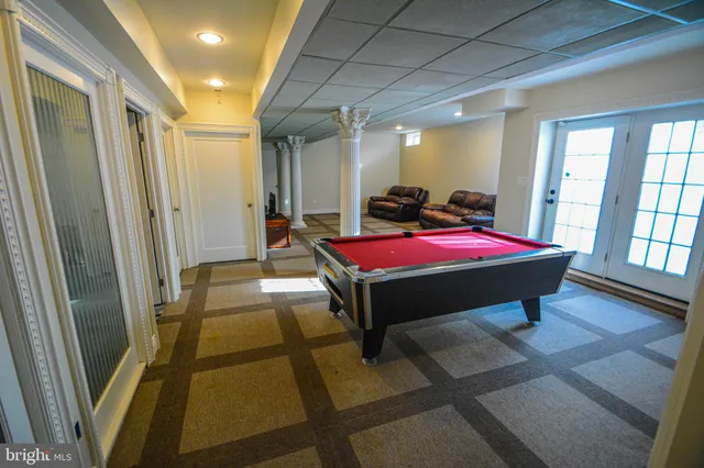 a bed room with a bed and large window