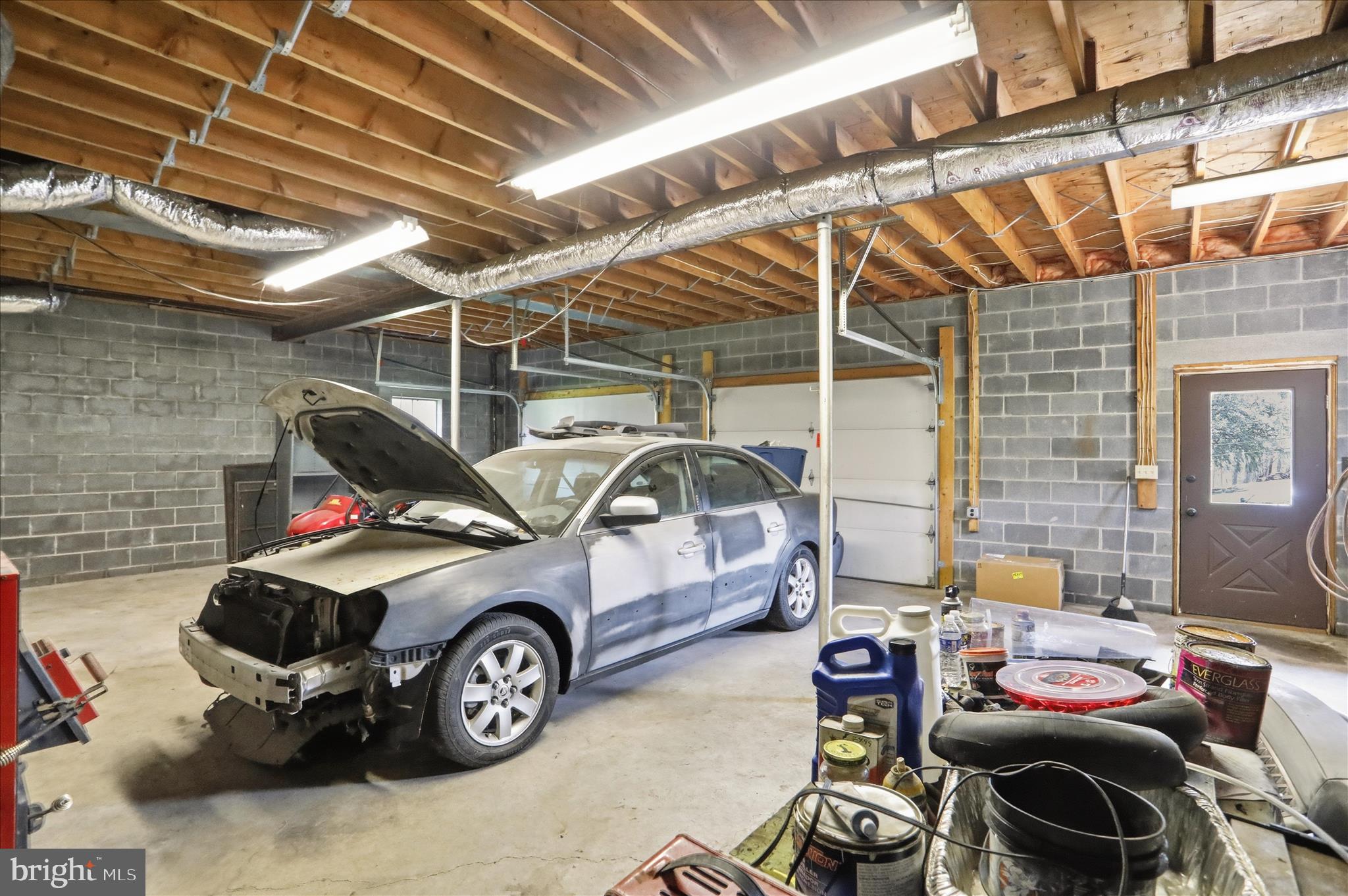 12623 Windy Ridge Drive Mount Savage, MD 21545 - Photo 48 of 72 a car and bike parked in a garage