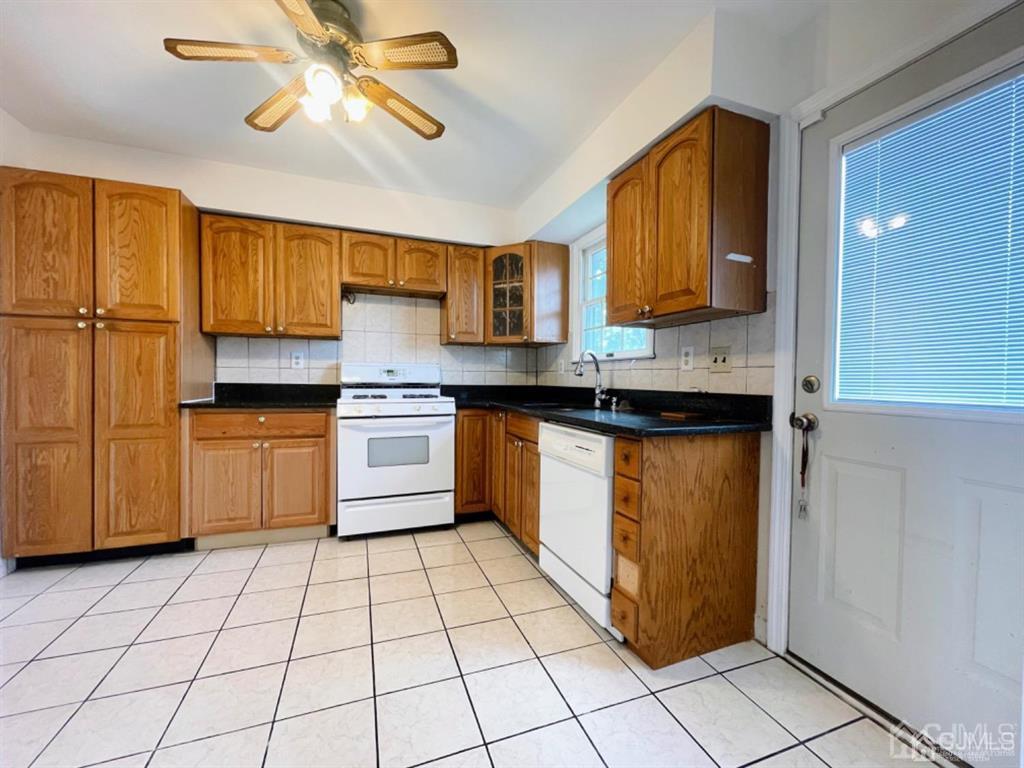 63 Dalton Place Edison, NJ 08817 - Photo 13 of 31 a kitchen with a stove a sink and a refrigerator