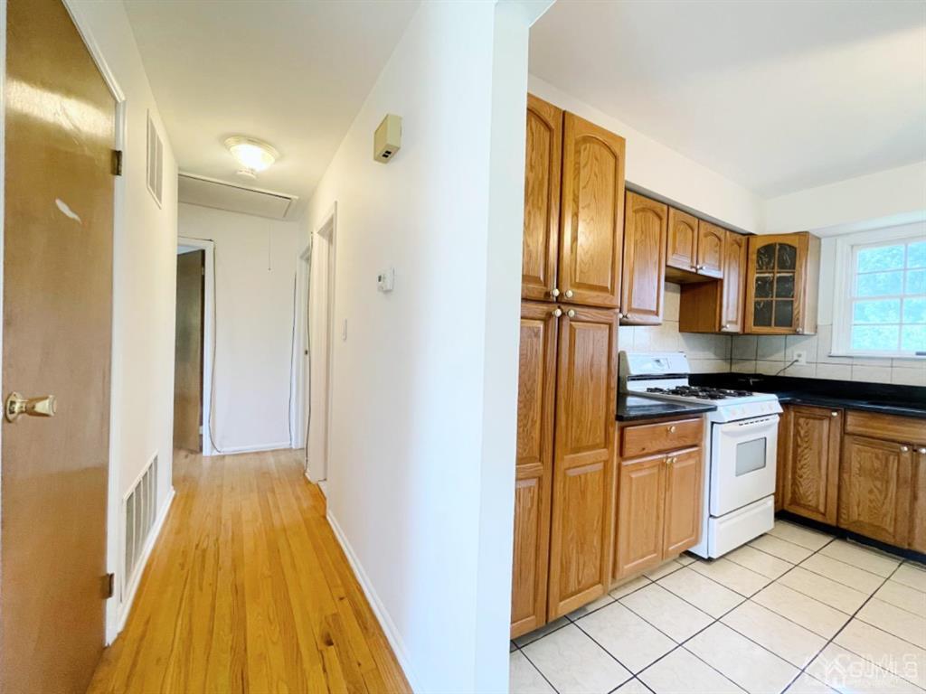 63 Dalton Place Edison, NJ 08817 - Photo 16 of 31 a view of a kitchen from the hallway