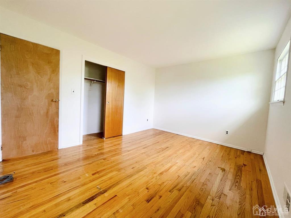 63 Dalton Place Edison, NJ 08817 - Photo 19 of 31 a view of empty room with wooden floor