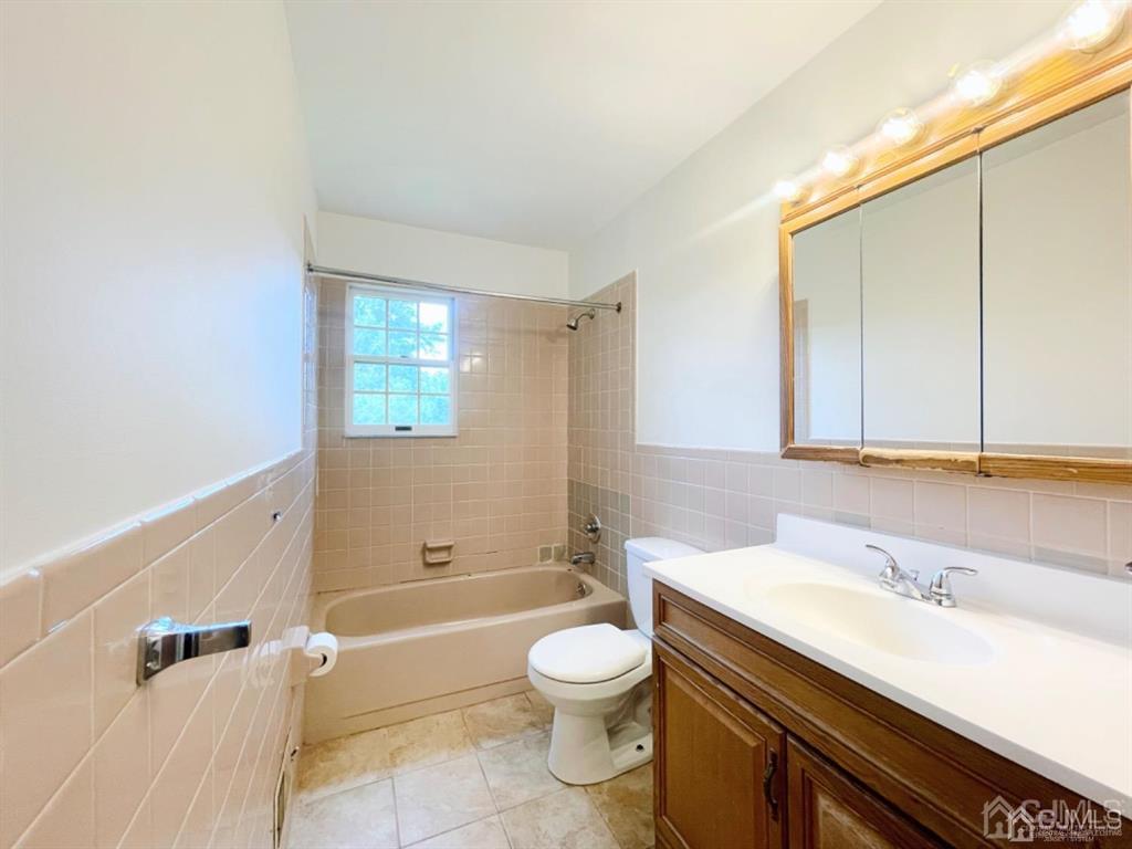 63 Dalton Place Edison, NJ 08817 - Photo 20 of 31 a bathroom with a granite countertop sink a toilet and shower