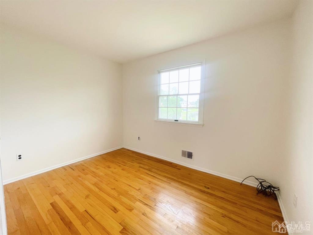 63 Dalton Place Edison, NJ 08817 - Photo 25 of 31 an empty room with a window