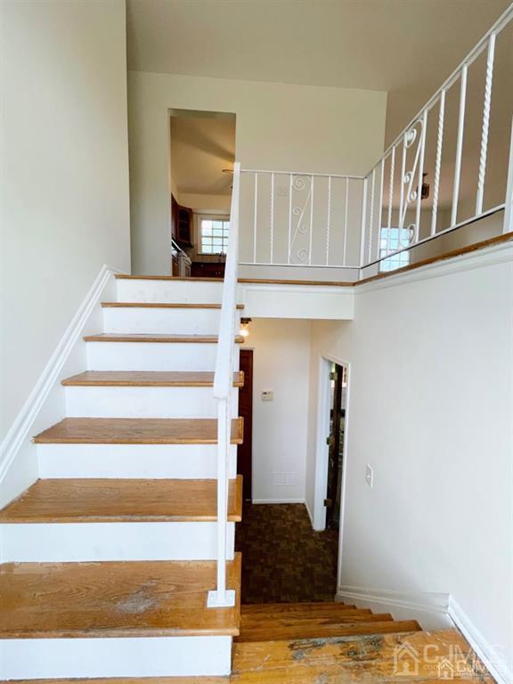 63 Dalton Place Edison, NJ 08817 - Photo 28 of 31 a view of entryway and hall with wooden floor