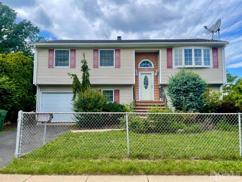 63 Dalton Place Edison, NJ 08817 - Photo 3 of 31 a front view of a house with a yard