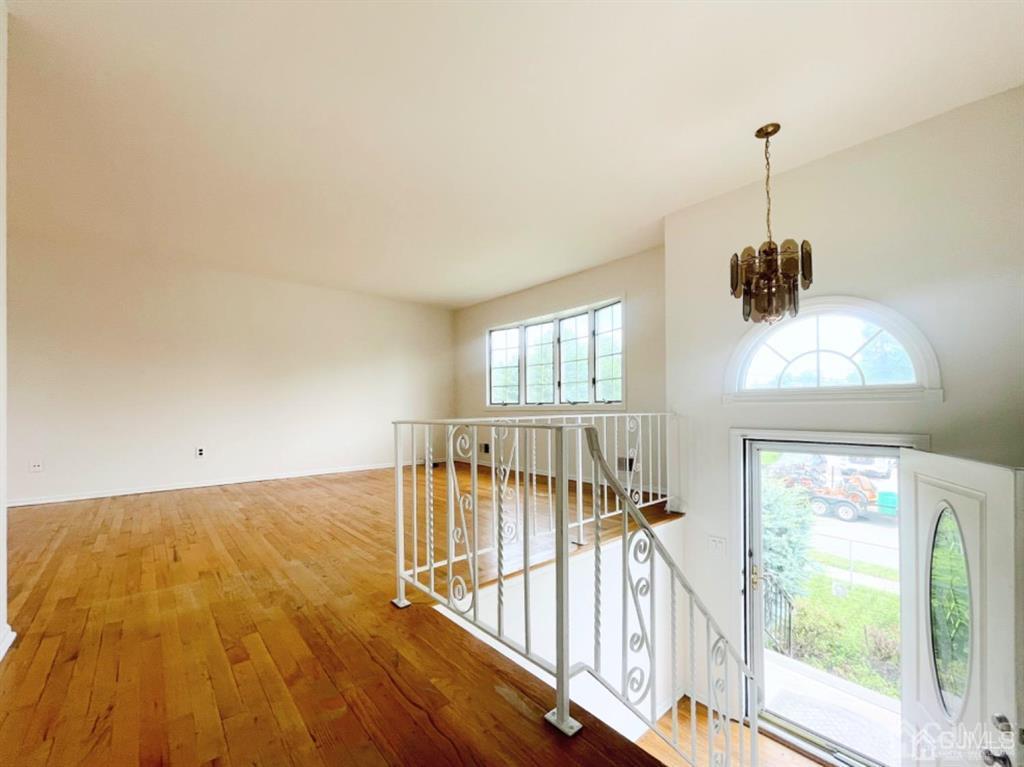 63 Dalton Place Edison, NJ 08817 - Photo 6 of 31 a view of empty room with wooden floor and fan