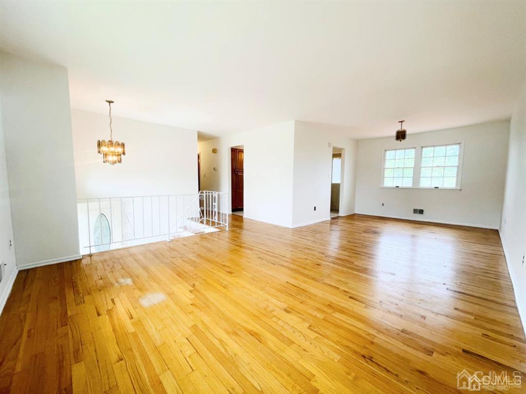 63 Dalton Place Edison, NJ 08817 - Photo 9 of 31 a view of a room with wooden floor and white walls