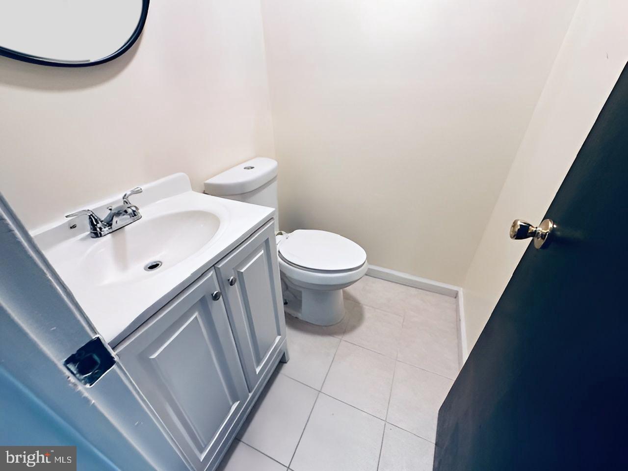 2 Devonshire Court Trenton, NJ 08628 - Photo 7 of 22 a bathroom with a sink a toilet and mirror