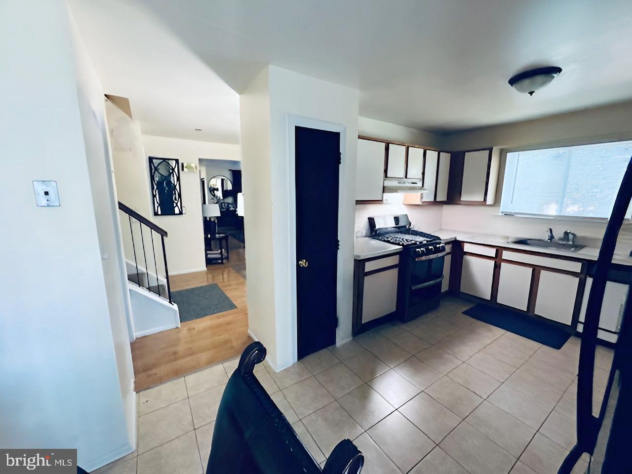 2 Devonshire Court Trenton, NJ 08628 - Photo 8 of 22 a kitchen with stainless steel appliances granite countertop a refrigerator a stove and a sink with wooden floor