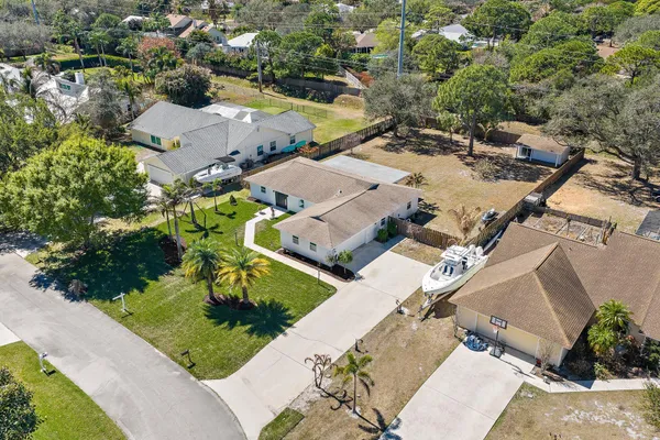 an aerial view of a house with a garden