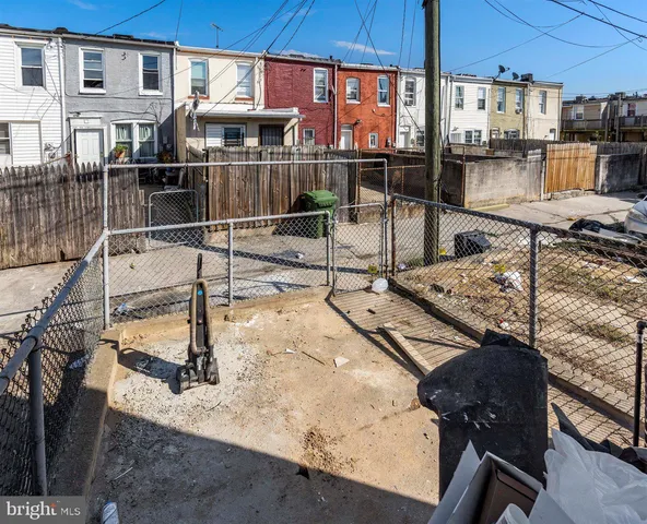 a view of a balcony with two chairs and a table