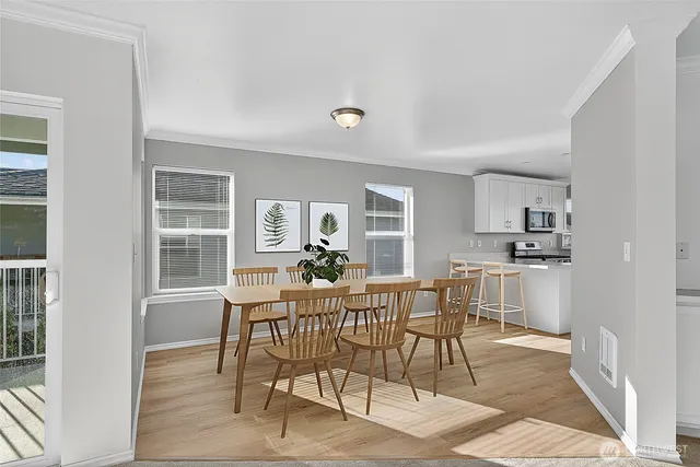 a dining room with furniture and window