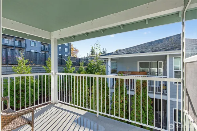 a view of a balcony with wooden floor
