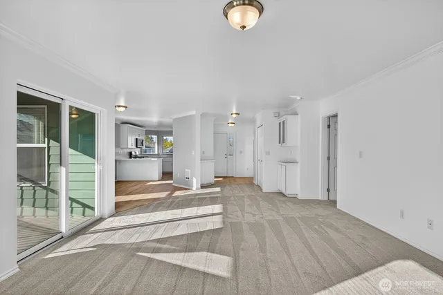 a view of a living room and front door