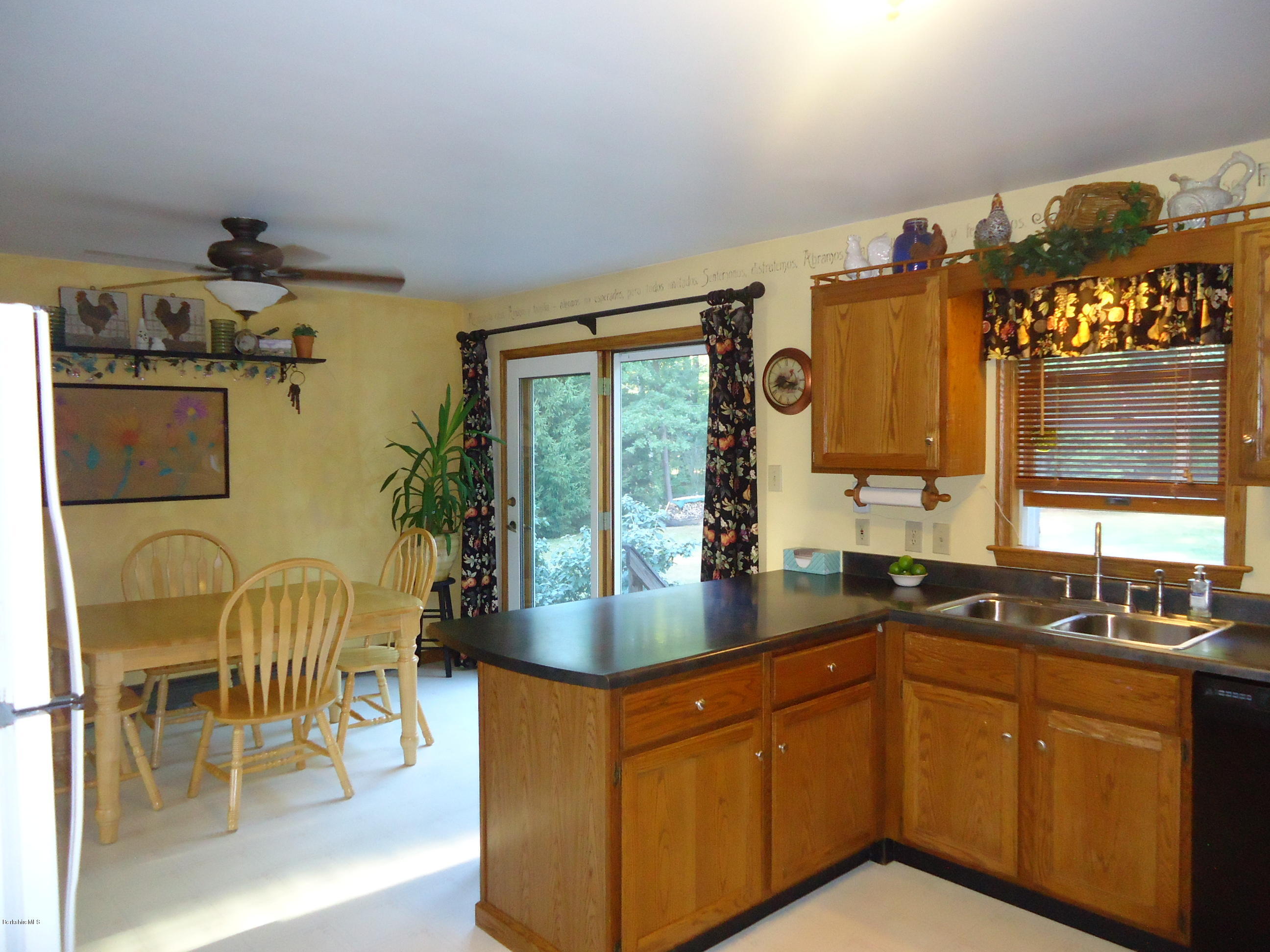 209 Polikoff Road Sheffield, MA 01222 - Photo 4 of 16 a kitchen with granite countertop cabinets a sink and a stove