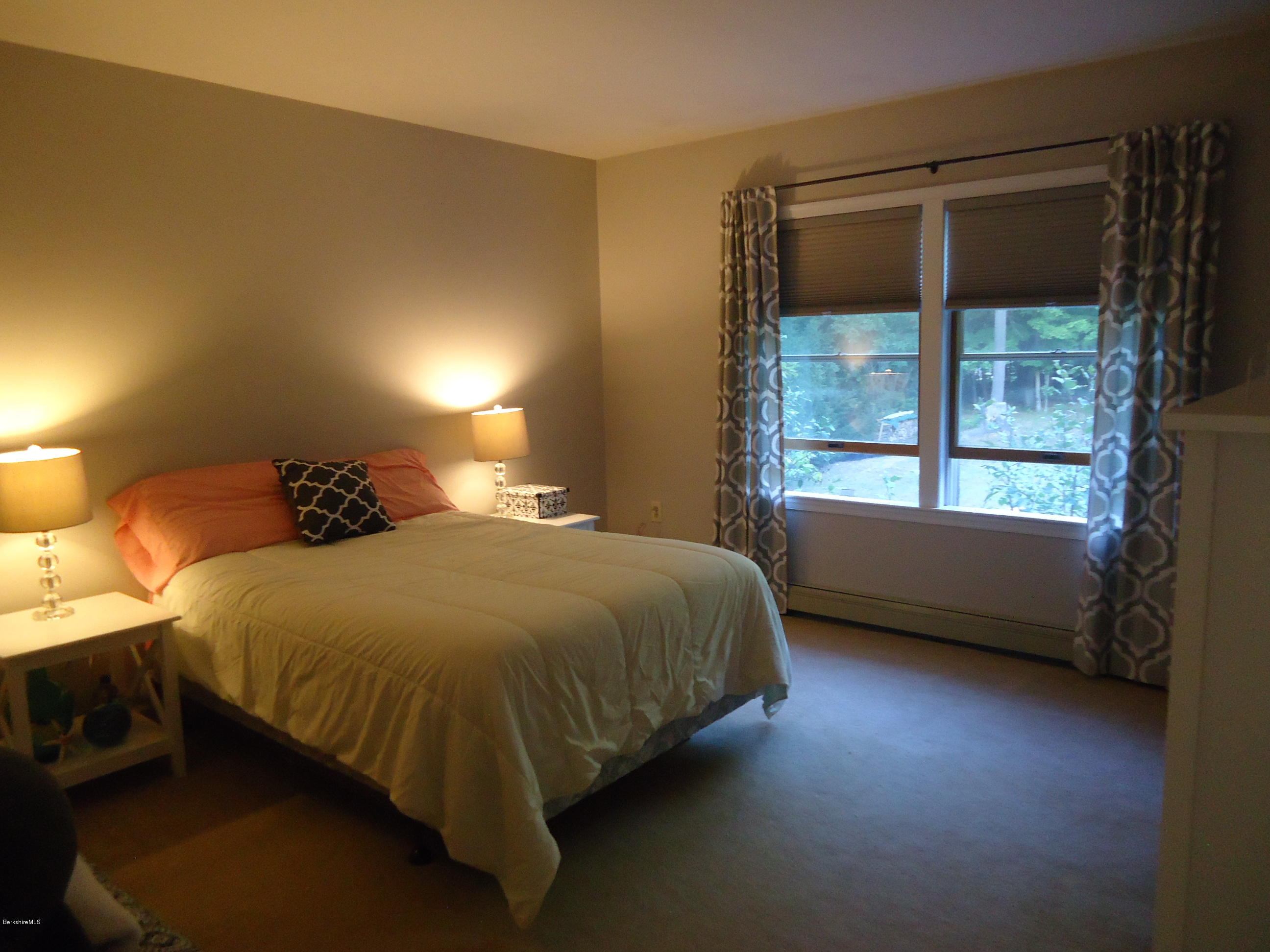 209 Polikoff Road Sheffield, MA 01222 - Photo 7 of 16 a bedroom with a bed and a window