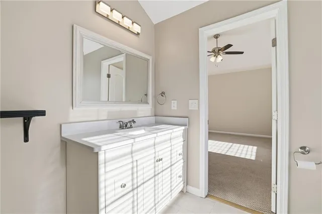 a bathroom with a sink a mirror and a shower