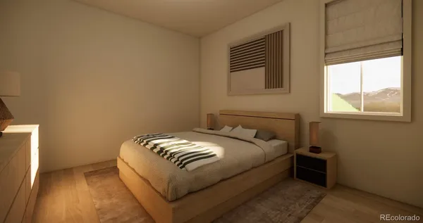 a bed sitting in a bedroom next to a window