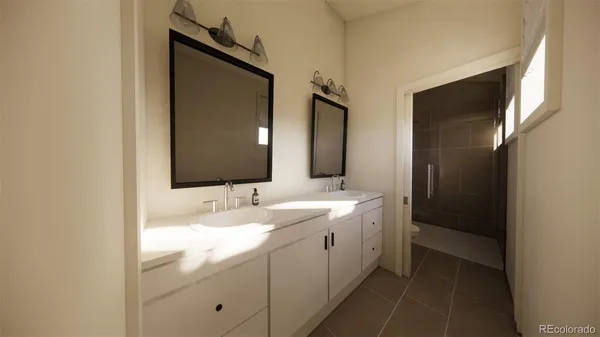 a bathroom with a double vanity sink and mirror