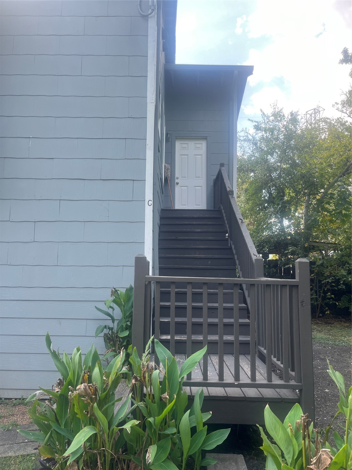 5404 Pease Street, Unit 3 Houston, TX 77023 - Photo 2 of 8 a view of a backyard with chairs potted plants