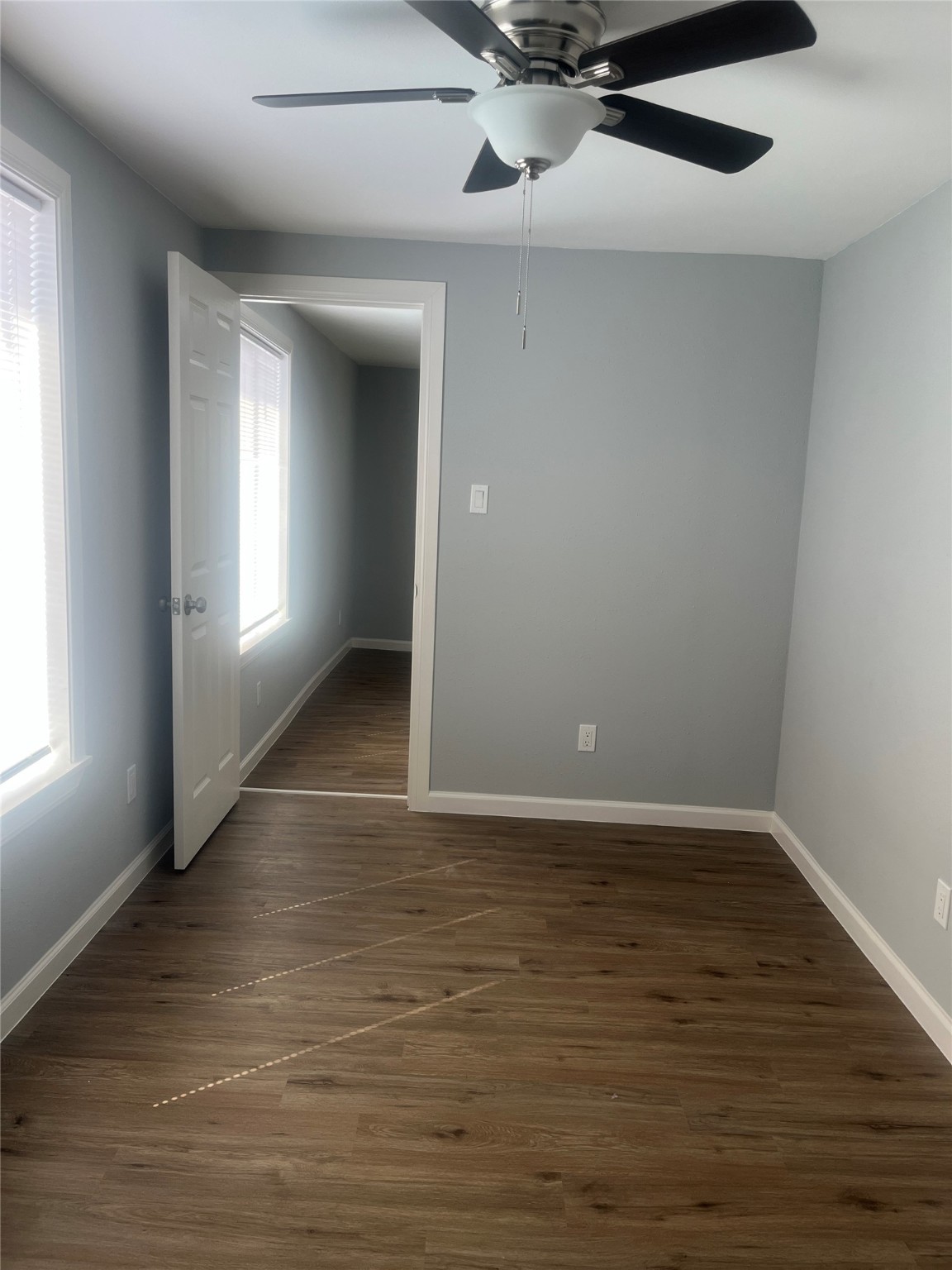 5404 Pease Street, Unit 3 Houston, TX 77023 - Photo 7 of 8 an empty room with wooden floor and windows