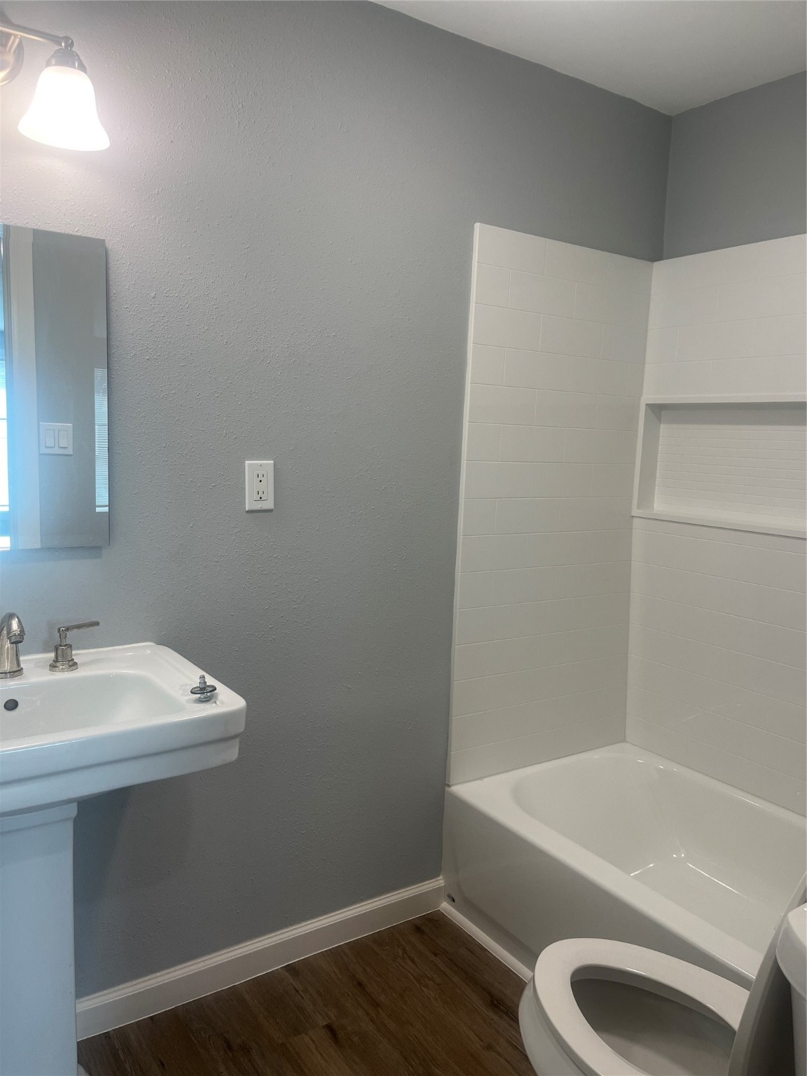 5404 Pease Street, Unit 3 Houston, TX 77023 - Photo 9 of 9 a bathroom with a sink a toilet and bathtub